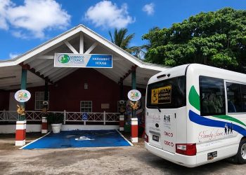 Image of the New BCD Accessible bus parked at the BCD's head quarters at Harambee House.